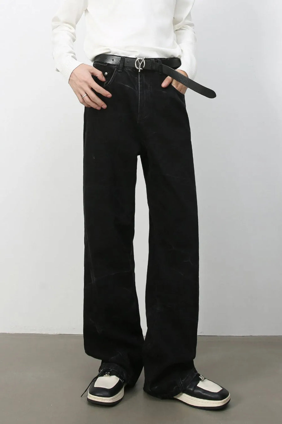 Faded black wide-leg denim jeans with a relaxed fit.