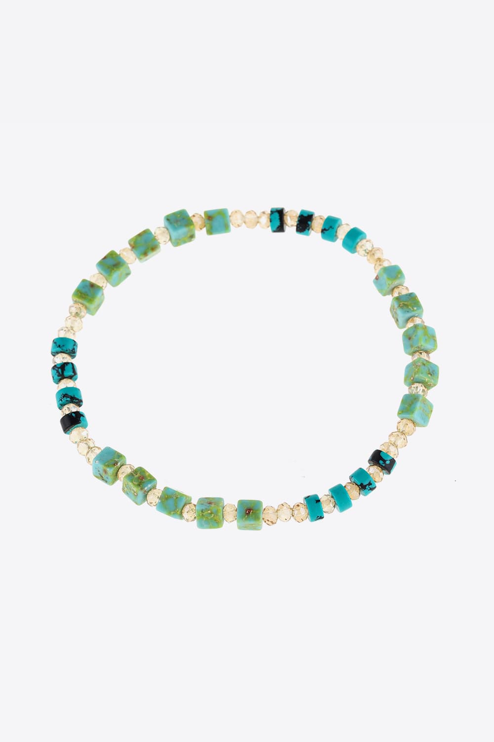 Turquoise cube and crystal beaded bracelet with teal and light green accents.