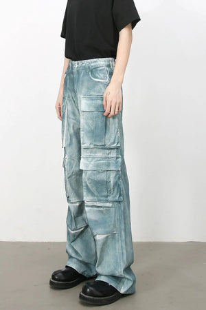 Bleached denim utility trousers in medium with multiple cargo pockets and a relaxed fit.