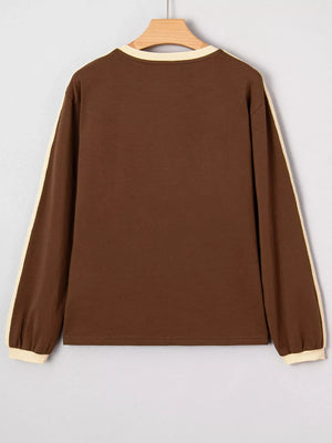 Contrast crew-neck long-sleeve t-shirt in dark brown with cream trim on sleeves and neckline.