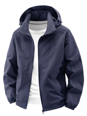 Dark blue hooded windbreaker jacket with zipper and pockets, worn over a white t-shirt.