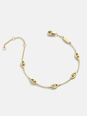 Gold chain bracelet with devil eye charms and lobster clasp closure.