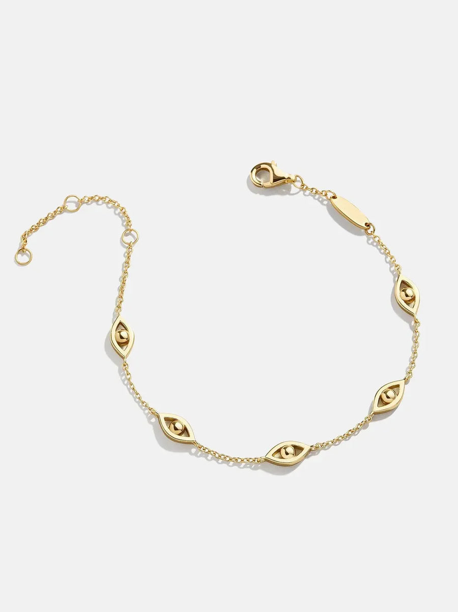 Gold chain bracelet with devil eye charms and lobster clasp closure.