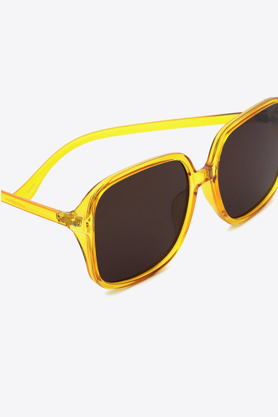 Yellow retro square frame sunglasses with dark lenses and bold acetate frames.