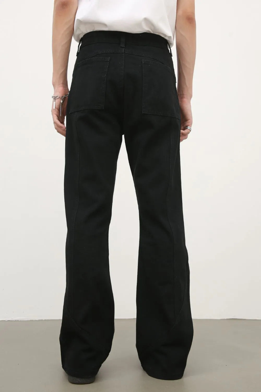 Black flare jeans with panel seams and a casual fit.