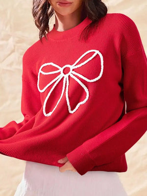 Deep red ribbed sweater with white bow detail and mock neckline.