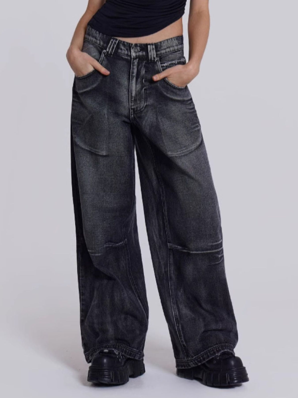 Black studded vintage wash wide leg jeans with a relaxed fit.