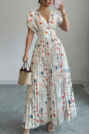Floral print maxi dress with flutter sleeves, V-neck, and pleated skirt.