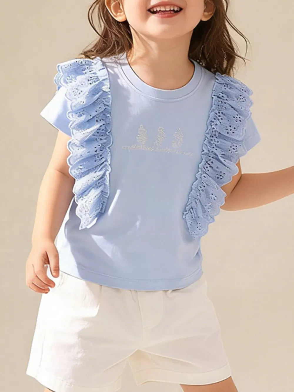 Light blue cotton t-shirt with ruffled lace sleeves and embroidered detail.