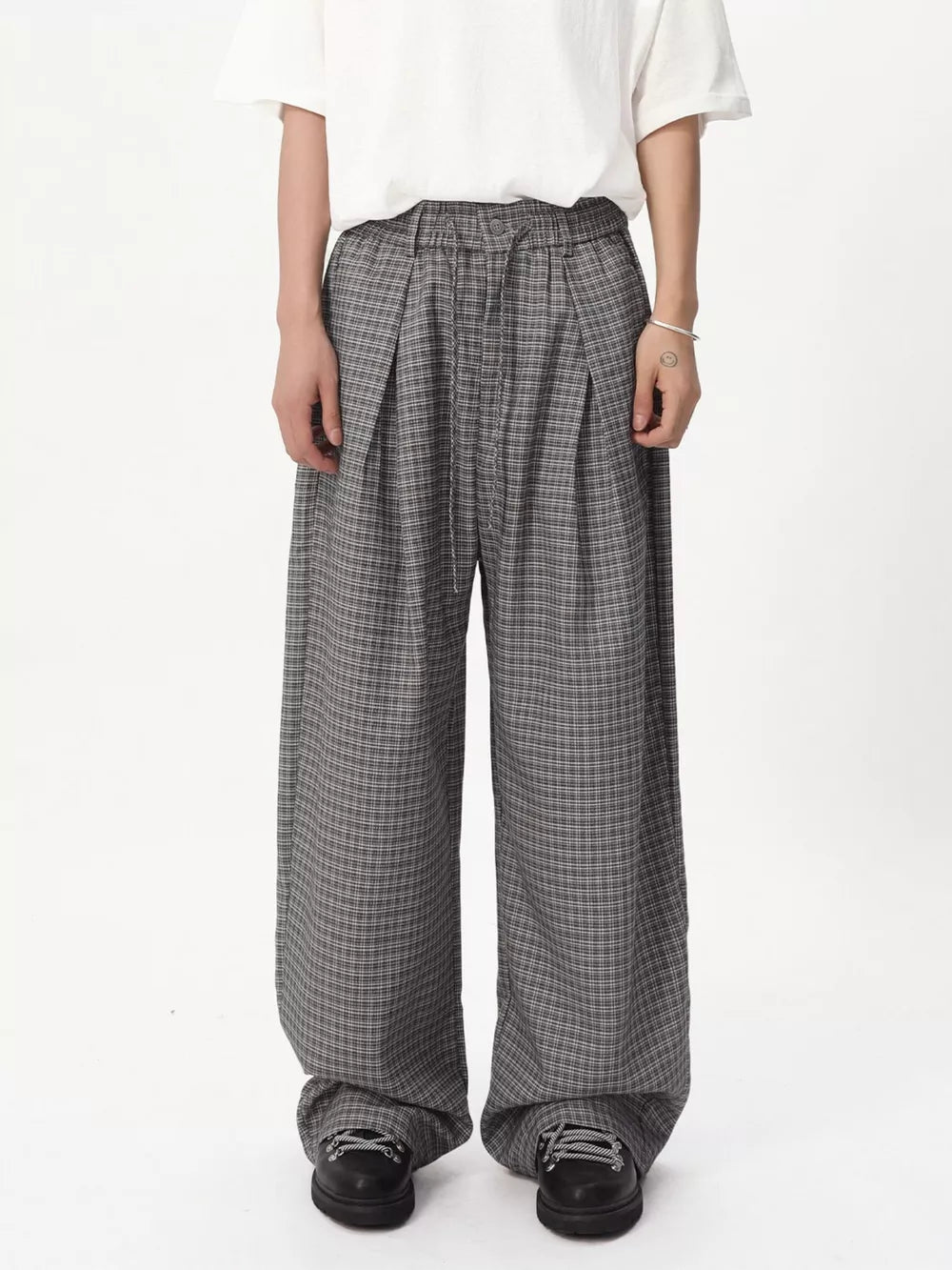 Plaid wide-leg relaxed fit pants in grey with adjustable drawstring waist.