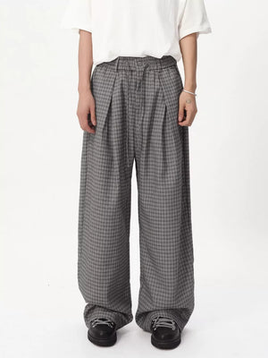 Plaid wide-leg relaxed fit pants in grey with adjustable drawstring waist.
