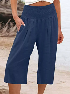 Navy blue cropped linen pants with smocked waist and pockets