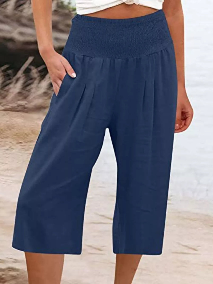 Navy blue cropped linen pants with smocked waist and pockets