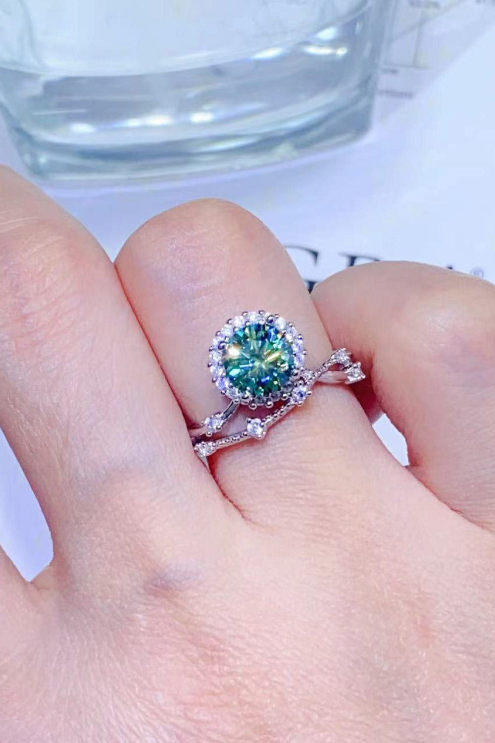 Celestial Halo Diamond Duo Ring in light green and white with diamond accents.