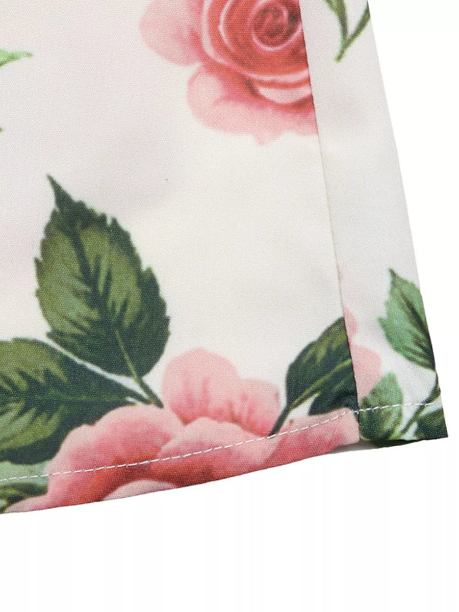 Elegant floral maxi skirt with pink roses and green leaves, showing pleated detail.