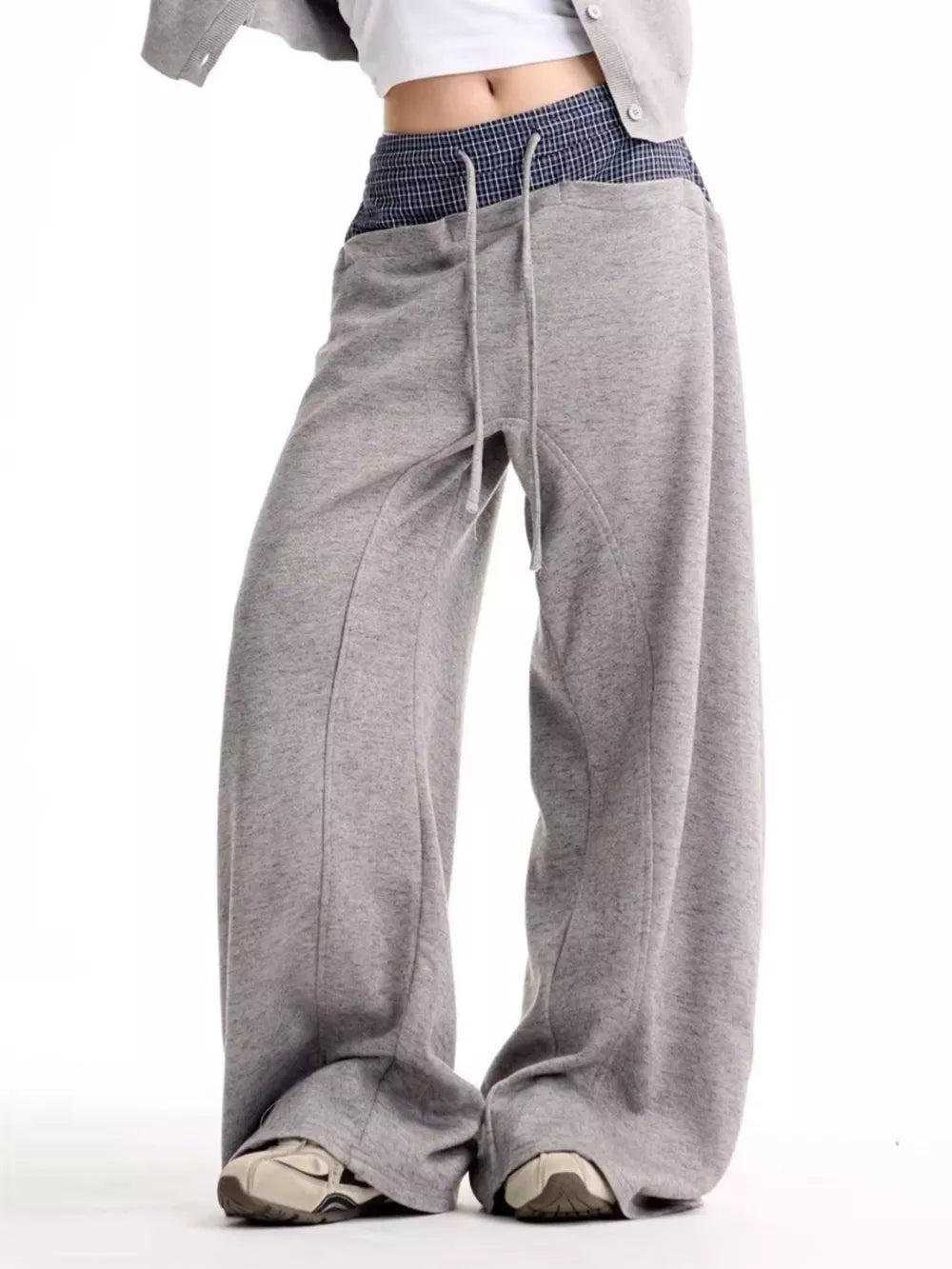 Grey wide-leg sweatpants with drawstring and checkered waistband detail