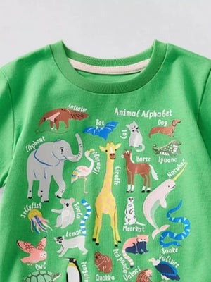 Green t-shirt with animal alphabet print featuring an elephant, giraffe, narwhal, and more.