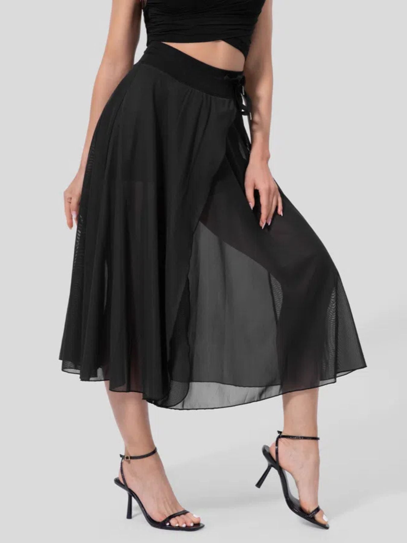 Black flowy midi skirt with shorts liner and drawstring detail.