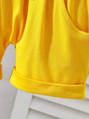 Yellow cotton baby tee and shorts set with cuffed hems and a pocket detail.