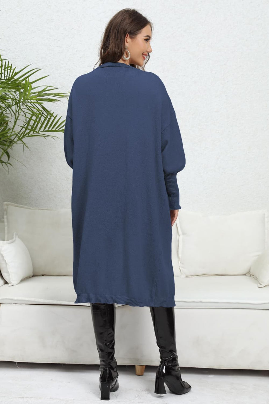 Dark Blue oversized pocketed knit cardigan with long sleeves and a collared neckline.