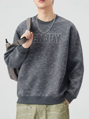 Men's dark gray acid wash sweatshirt with embroidered "ENJOY" text and crewneck.