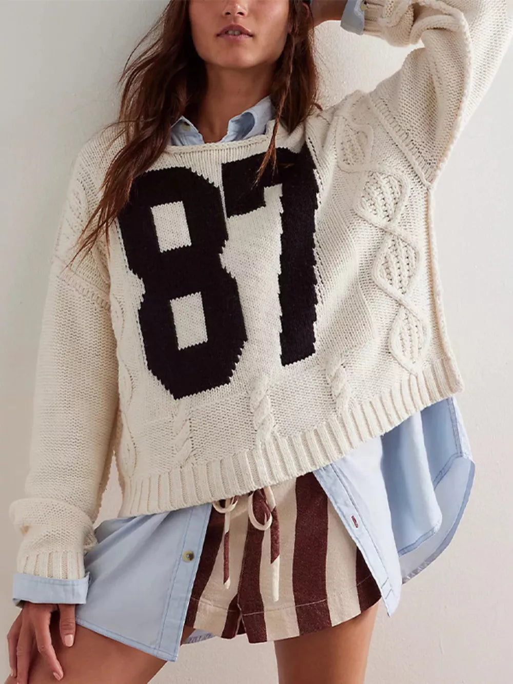 ivory pullover sweater with graphic print and crew neck