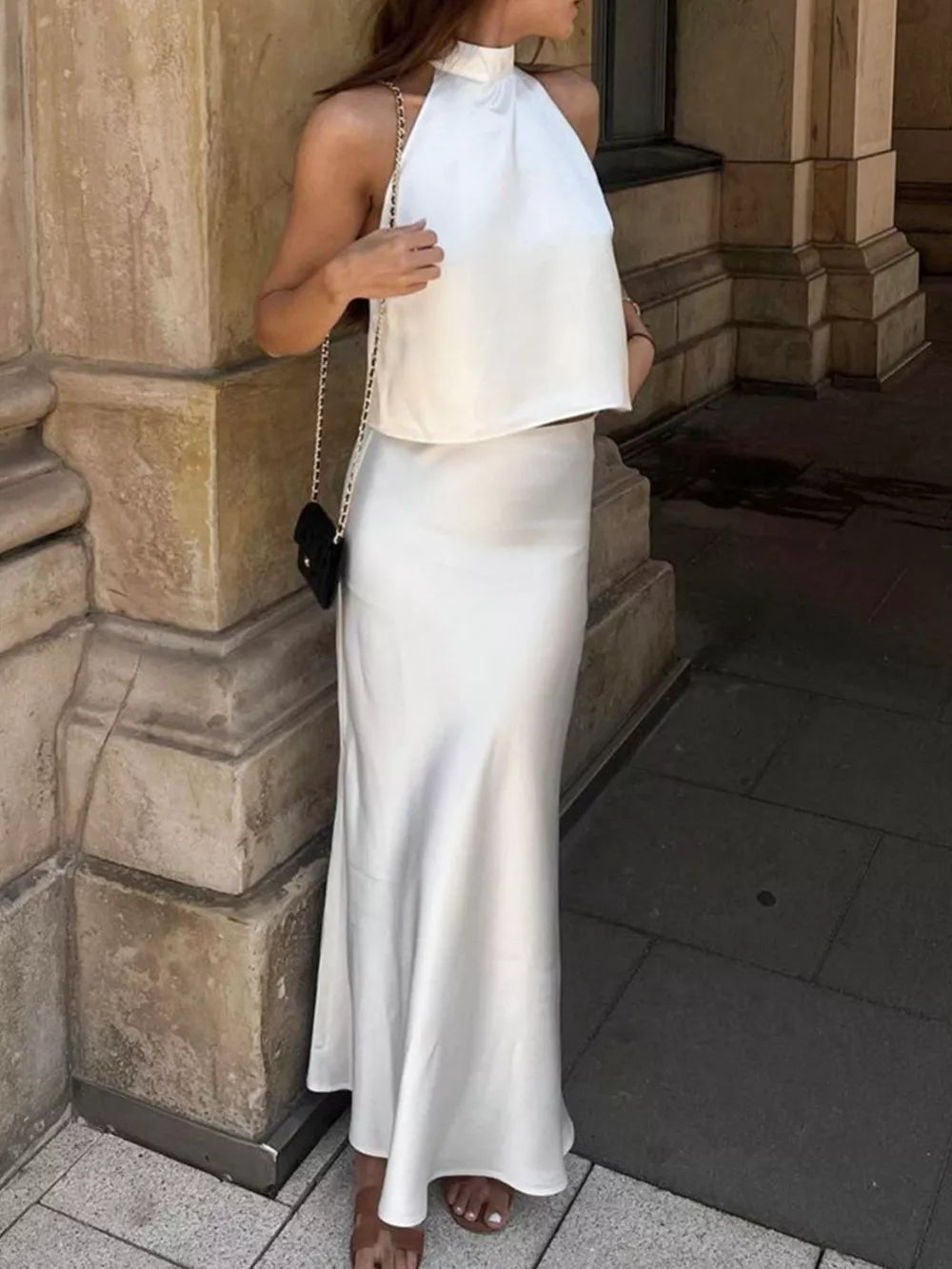 halter top in ivory featuring halter neck and relaxed fit
