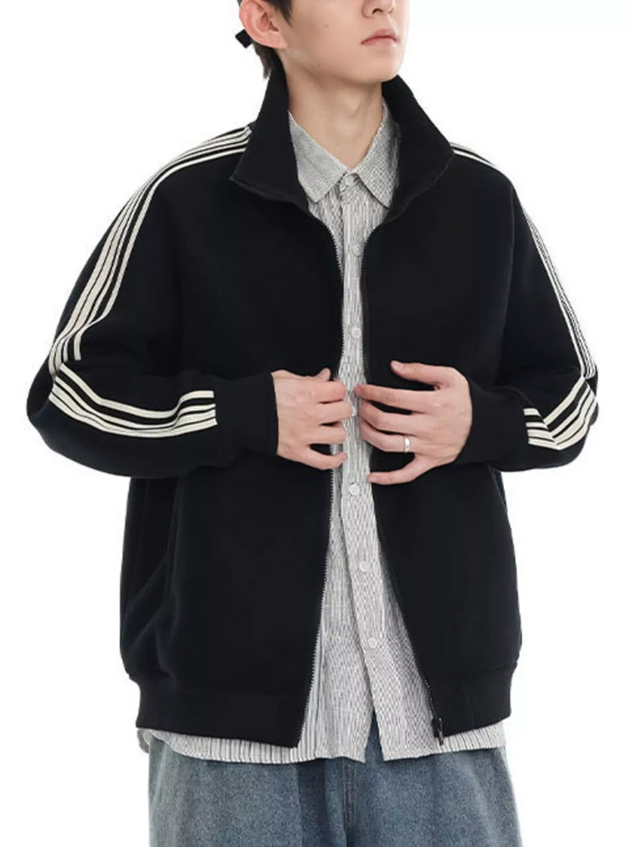 Black zip-up sweatshirt with contrast stripes on sleeves and collar.