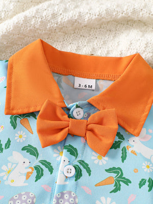 Baby bodysuit with orange collar and bow, featuring a blue bunny and carrot print.