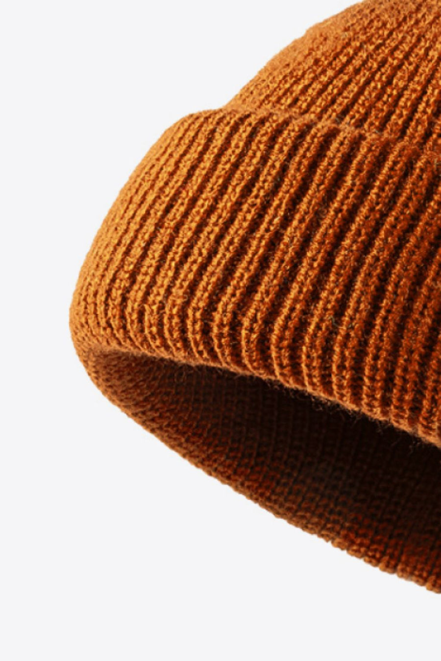 Folded edge ribbed knit beanie in brown acrylic with a casual, textured look.
