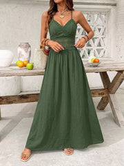 Green cotton blend maxi dress with lace trim on bodice and waist, spaghetti straps, and V-neck.