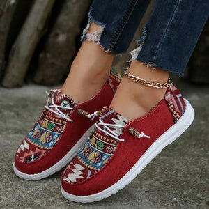 Deep Red canvas slip-on flats with embroidered geometric pattern and rope detail.