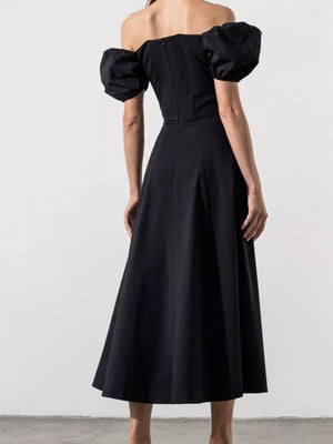 Black puff sleeve tie front midi dress with off-the-shoulder neckline.