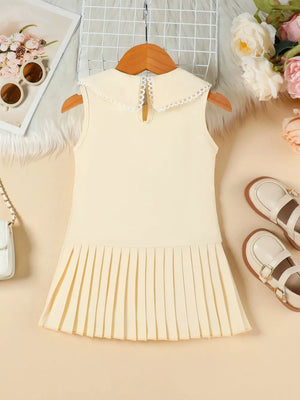 Apricot toddler dress with lace collar and pleated skirt