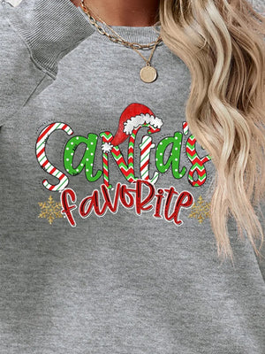 Gray crewneck sweatshirt with Santa's Favorite graphic, red and green candy cane stripes, polka dots, and snowflakes.