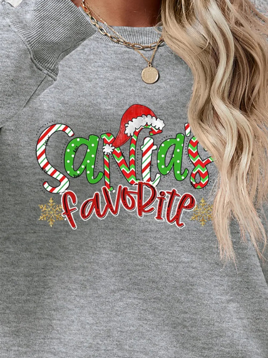 Gray crewneck sweatshirt with Santa's Favorite graphic, red and green candy cane stripes, polka dots, and snowflakes.