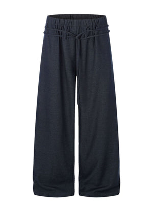 wide-leg pants in navy blue featuring drawstring waist and loose fit