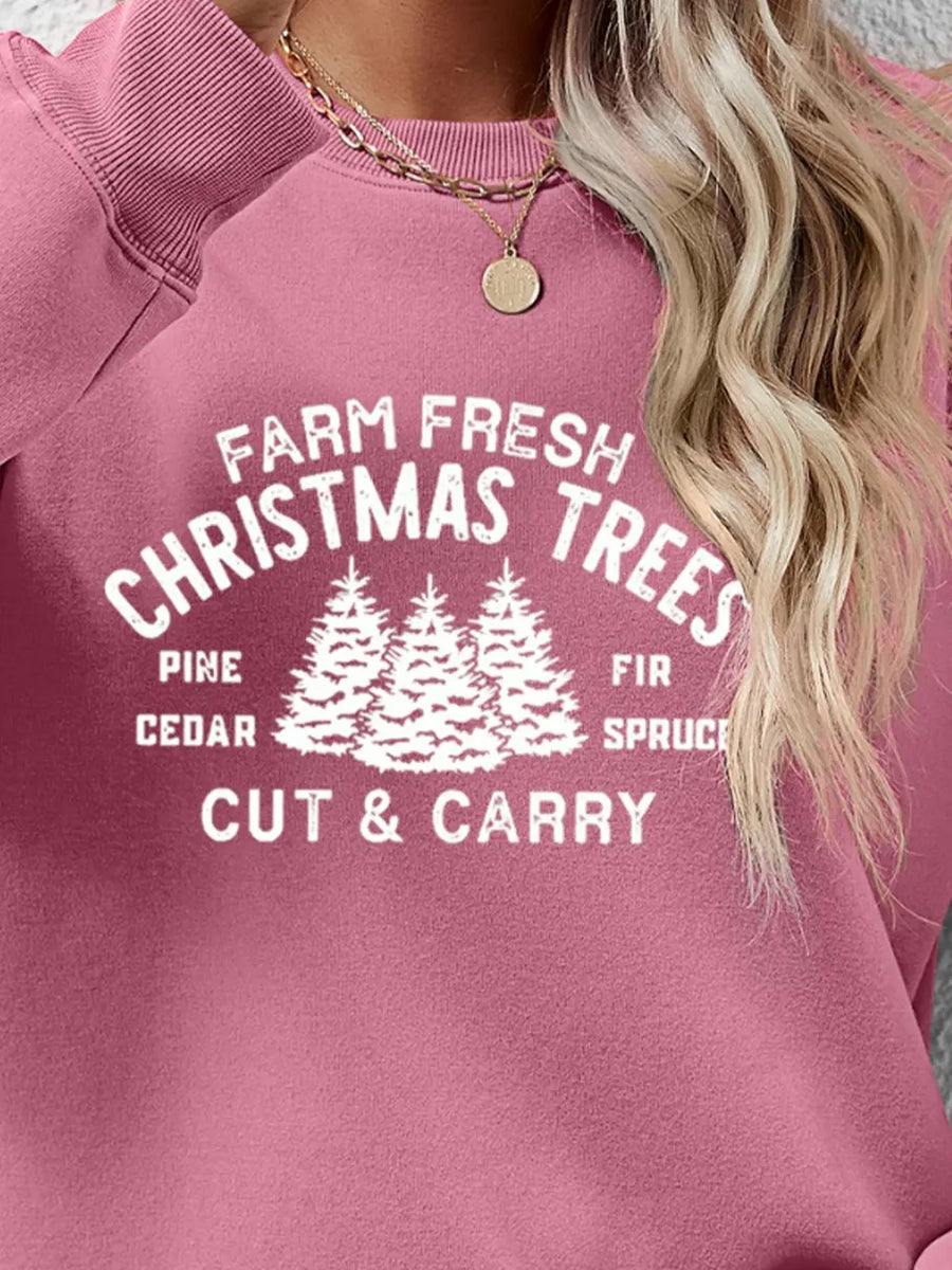 Blush pink crewneck sweatshirt with "Farm Fresh Christmas Trees" graphic and pine, cedar, fir, spruce, cut & carry text.