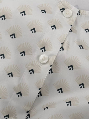White blouse with fan and square pattern, featuring button closure.
