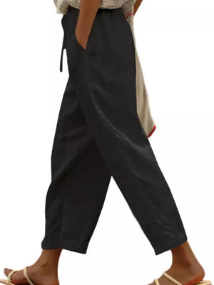 Black relaxed fit maternity pants with drawstring and pockets.