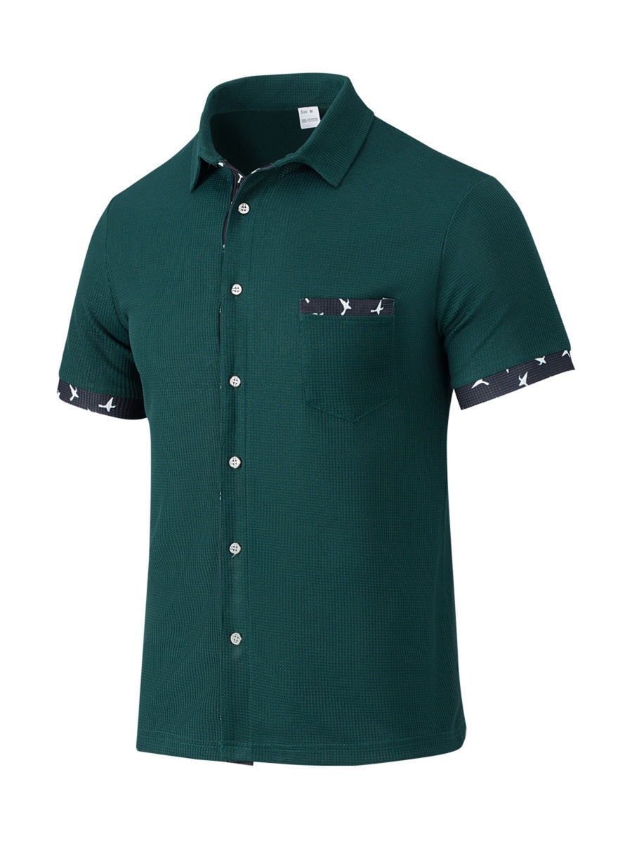 Olive green waffle textured button-up shirt with bird print trim on pocket and sleeves.