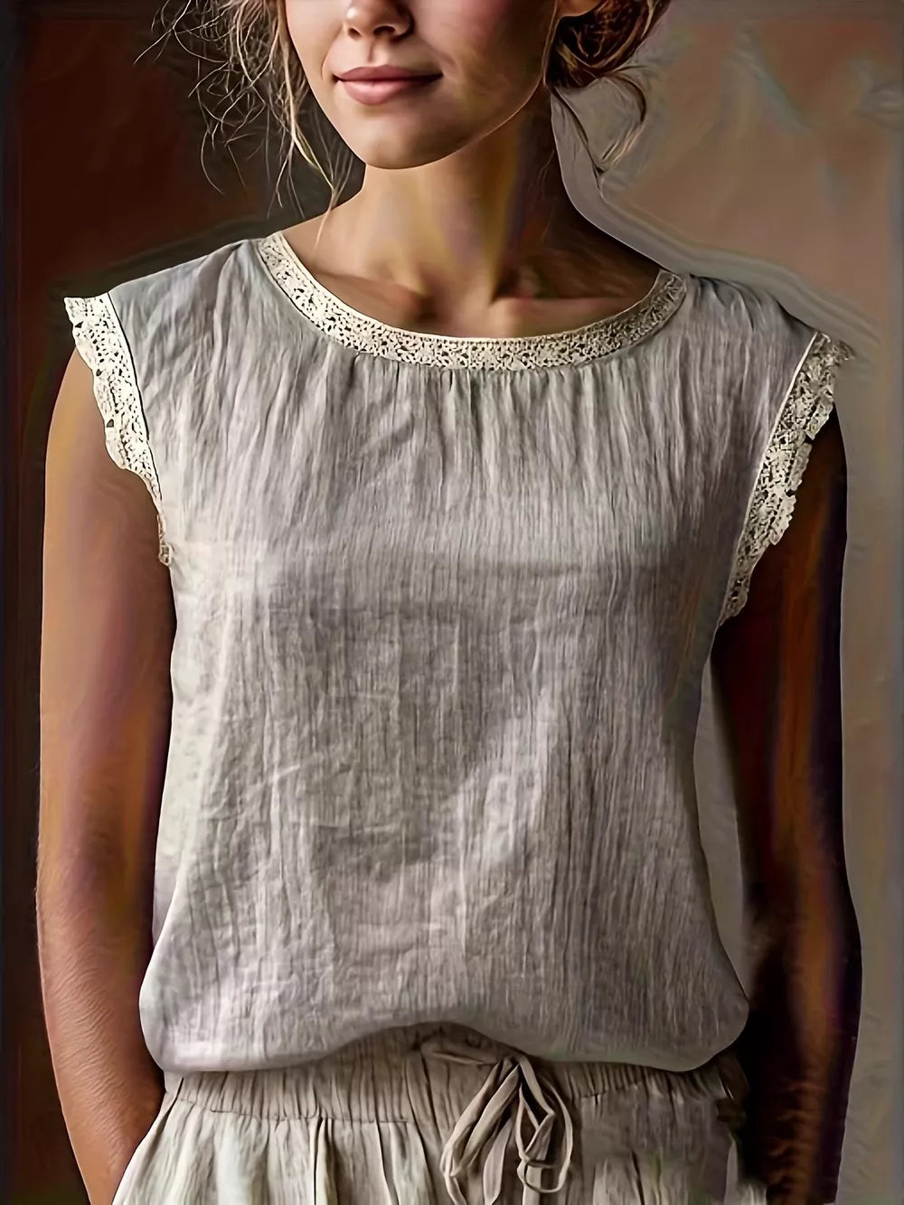 blouse in light gray featuring lace trim and relaxed fit