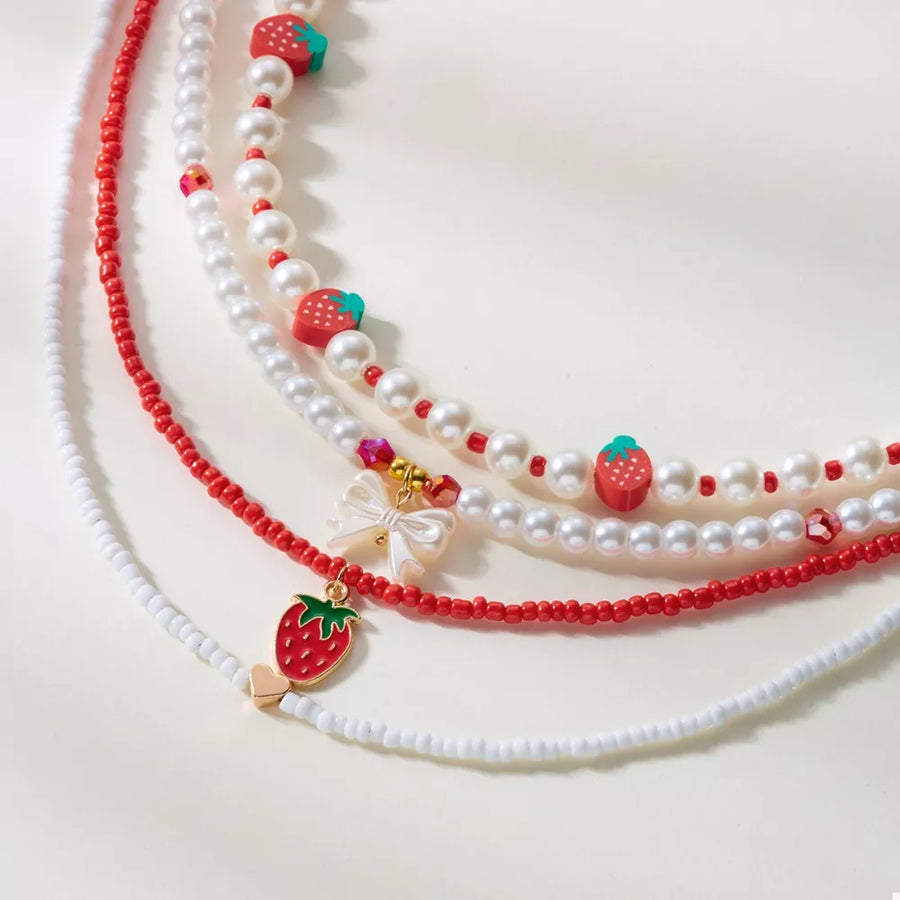 red necklace featuring beaded and novelty