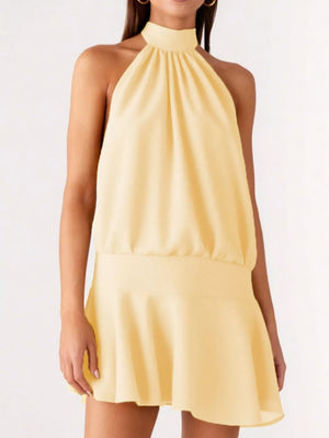 Yellow halter neck mini dress with gathered bodice and flared skirt.