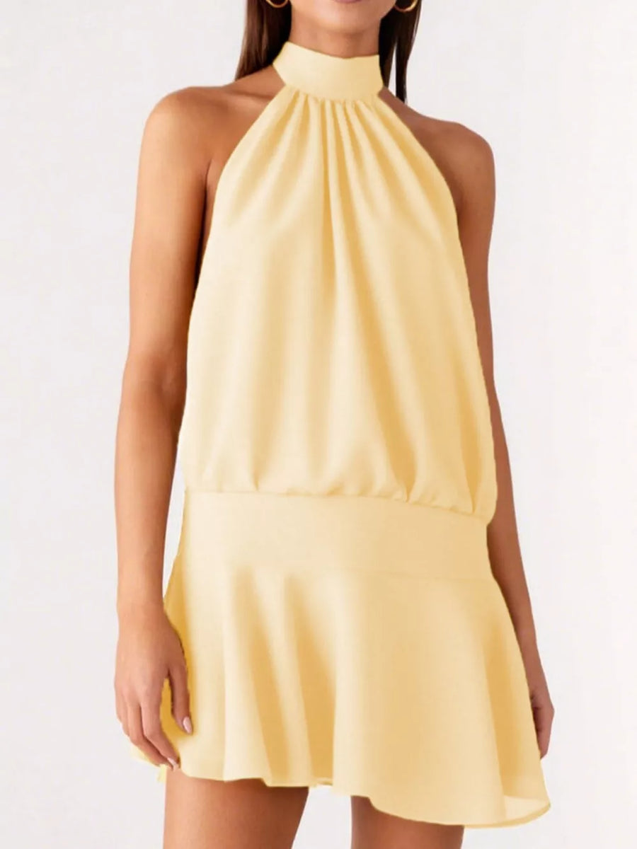 Yellow halter neck mini dress with gathered bodice and flared skirt.