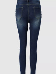 Dark blue skinny jeans with zipper detail and raw hem