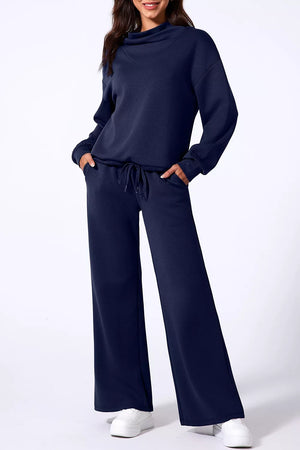 50% polyester, 45% viscose, 5% elastane Care instructions: Machine wash cold lounge set in navy blue with relaxed silhouette