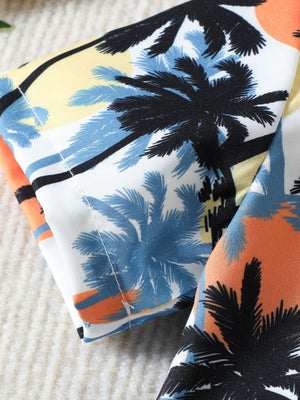 Toddler cotton shirt with tropical palm tree print in orange and sky blue.