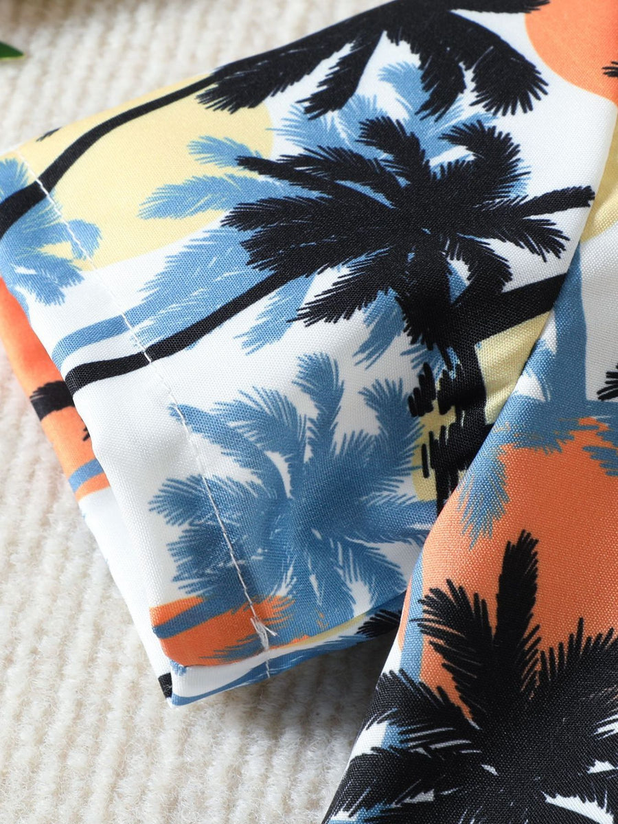 Toddler cotton shirt with tropical palm tree print in orange and sky blue.