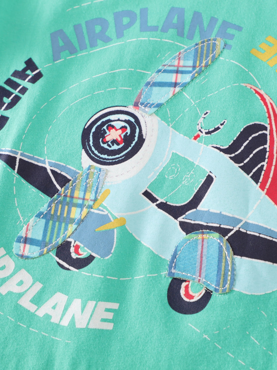 Green cotton toddler set with a light blue airplane graphic and plaid accents.